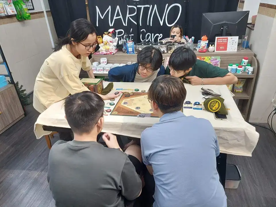 A group of friends playing board game at the shop