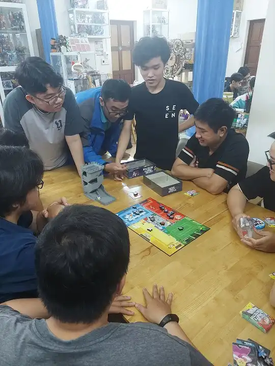 Another group of friends playing board game at the shop