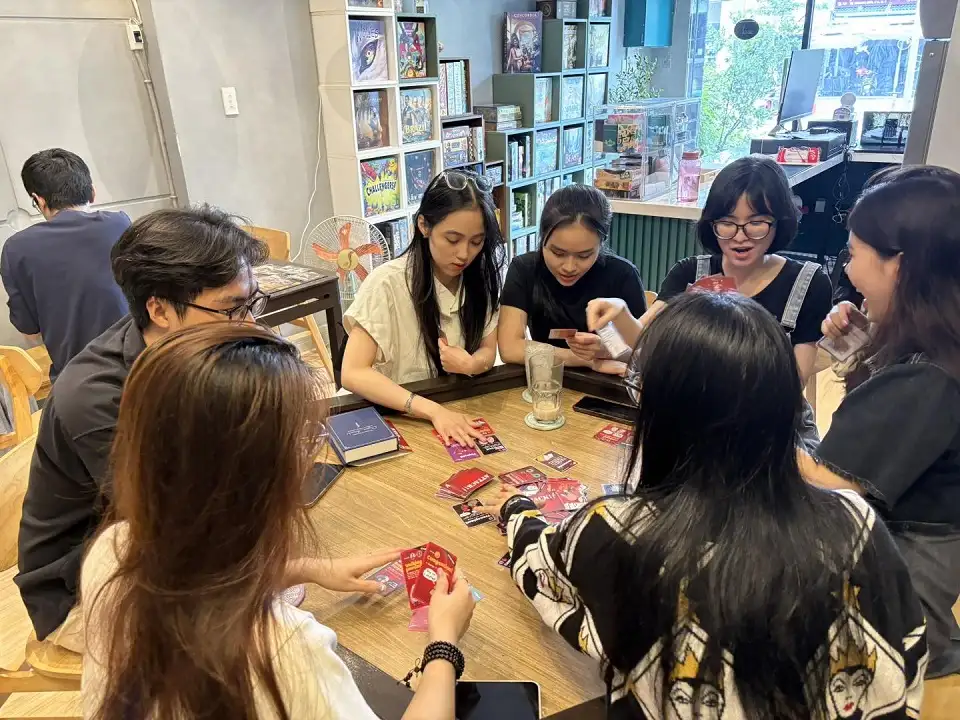 Group of friends plays party board games at Gameology Hub